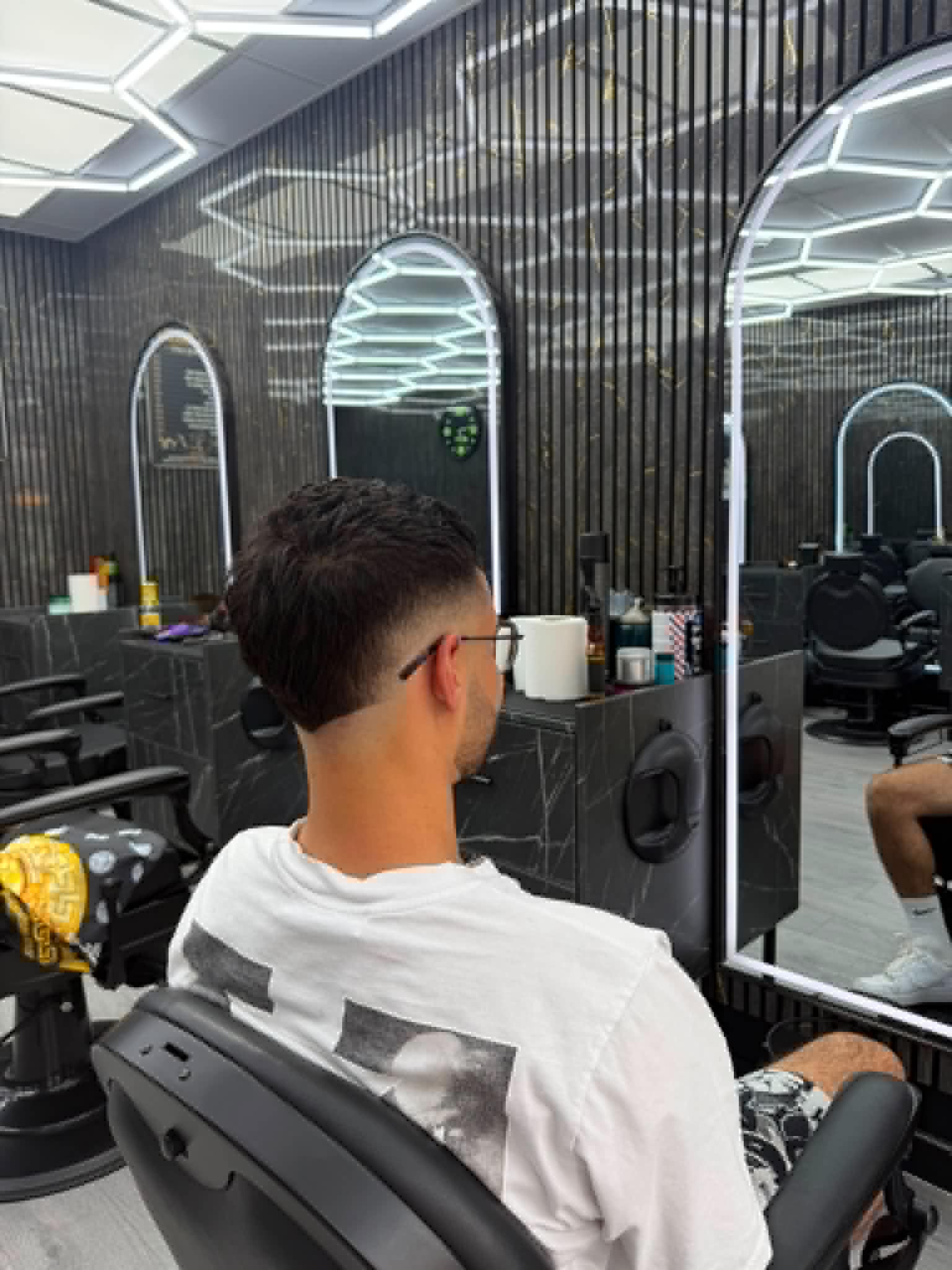 Modern taper haircut inside S&H Barber